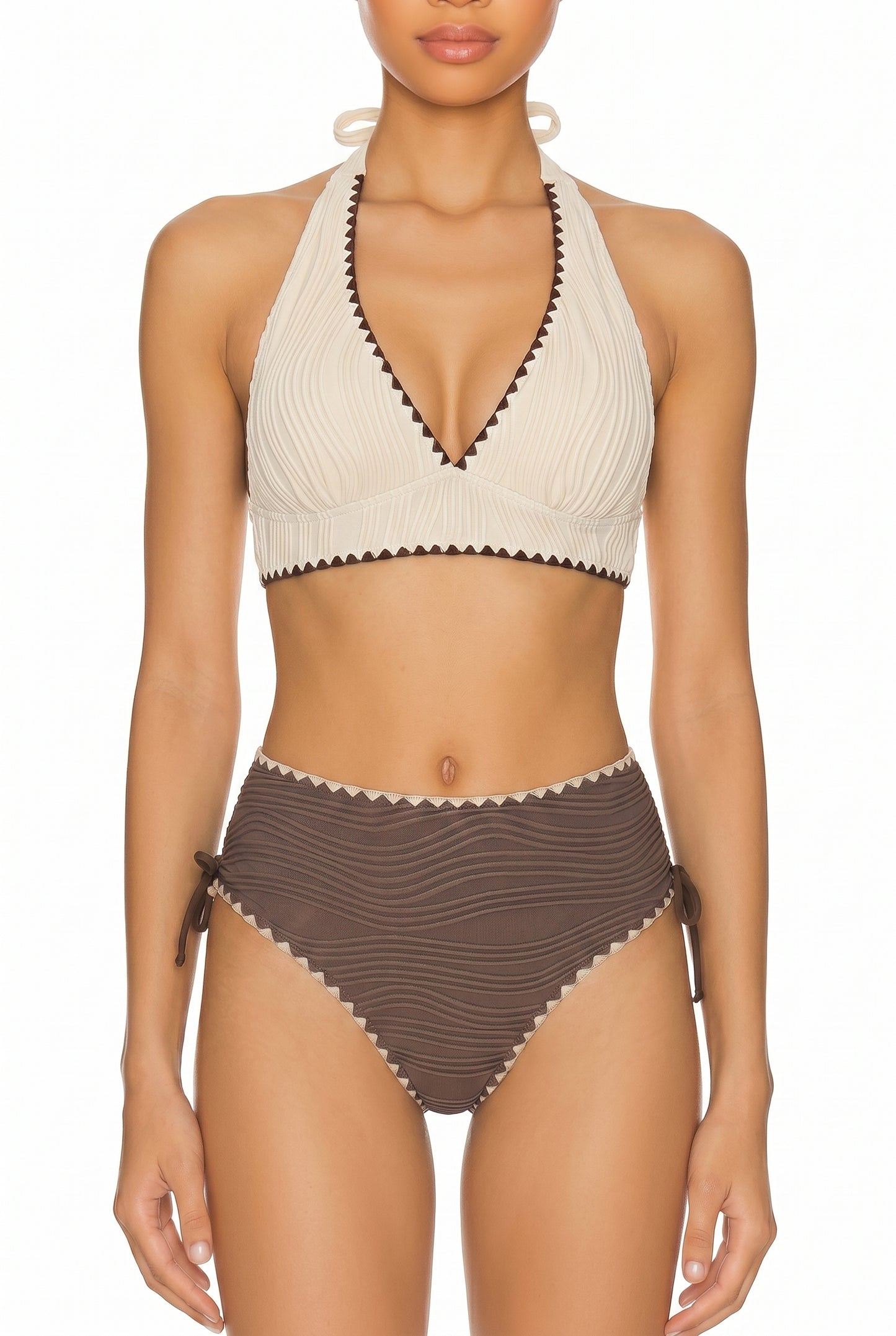 Cream halter bikini top with brown scalloped trim and brown high-waist bottoms on a white background