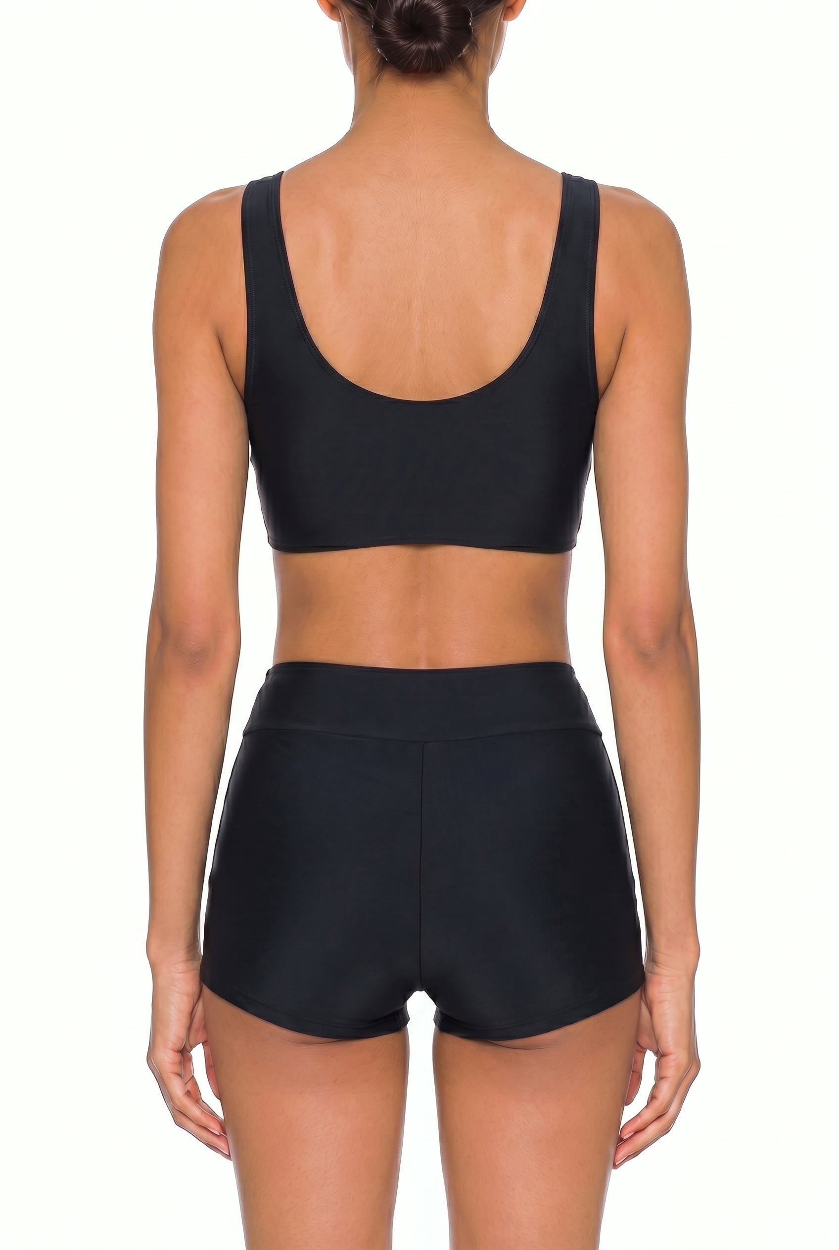 Black sleeveless swim crop top and high-waisted shorts, back view on white background