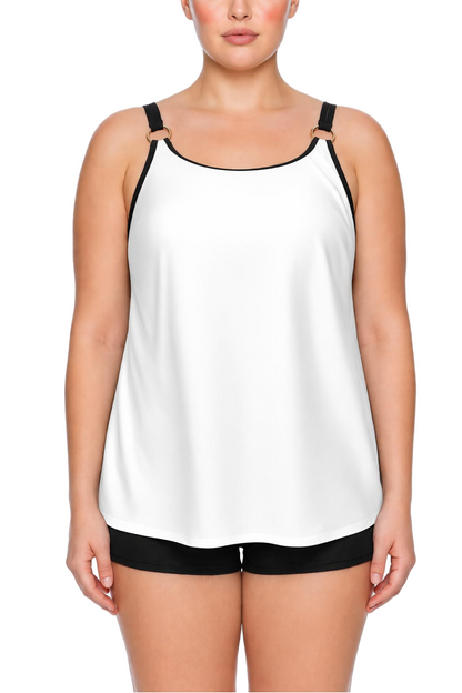 White tankini top with gold ring straps and black boyshort bottoms.